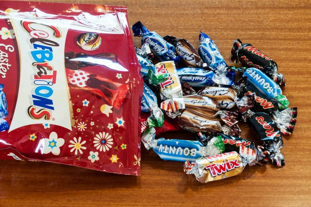 A bag of Celebrations chocolates spilled onto a table